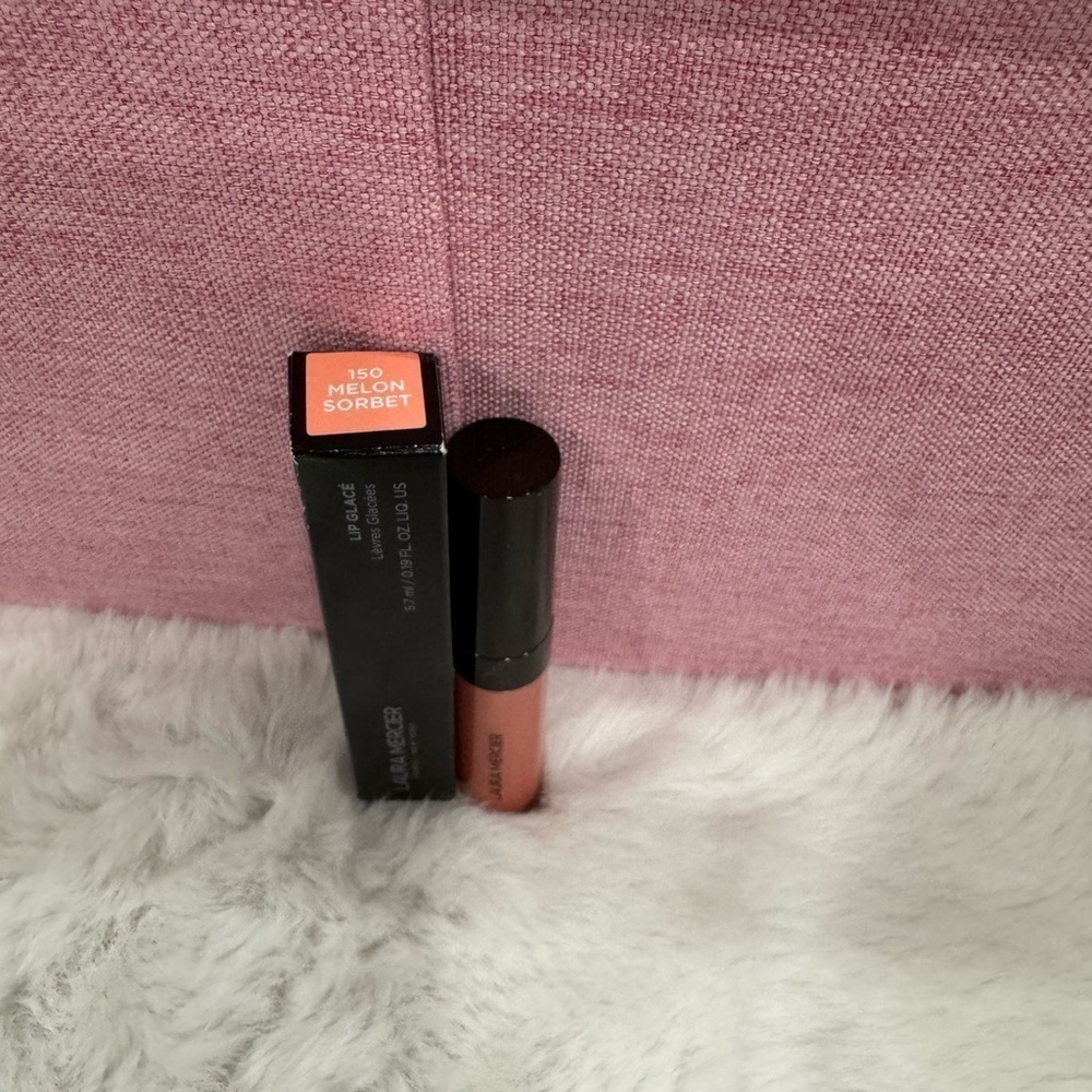 Laura Mercier
Lip Glacé Lip Gloss Color: 150 Melon Sorbet - light coral pink